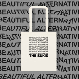 The Sukis Beautiful Alternative tote bag on grey typographic background